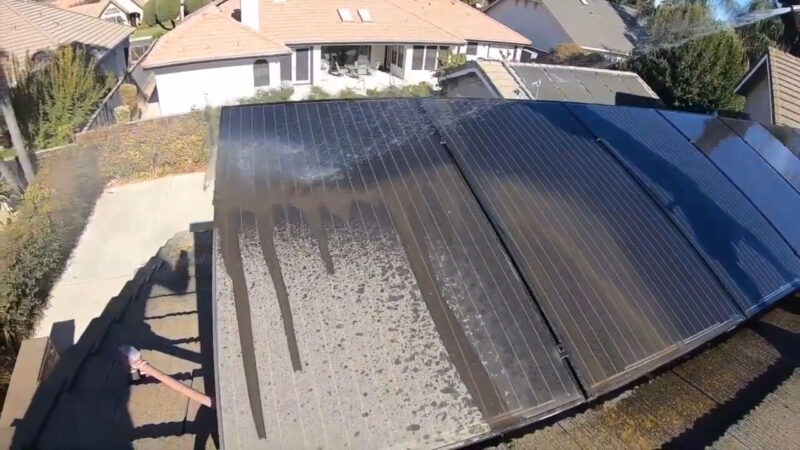 Washing solar panels with a hose